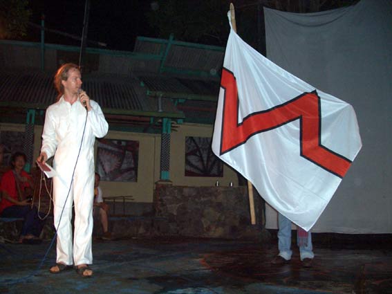 Explaining my internationalist stance with a KREV flag at IAPAO 2nd conference and festival, Bandung, indonesia